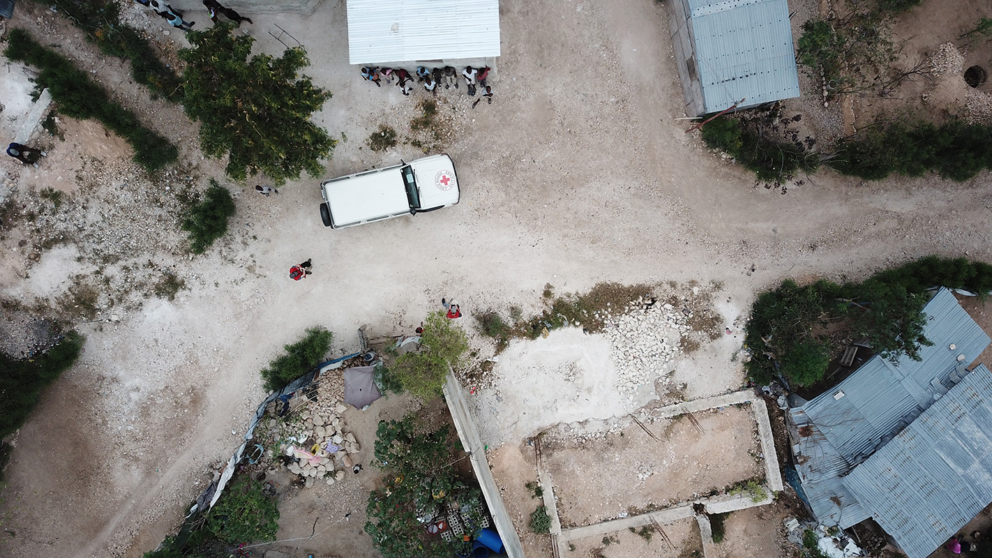 Aerial view from a drone of a Haitian Red Cross Land Cruiser.