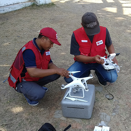 PMI team prepares a DJI Phantom for launch.